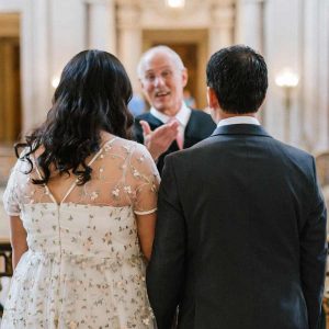 Officiator with Bride and Groom